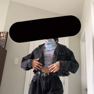 Black cropped jean jacket.